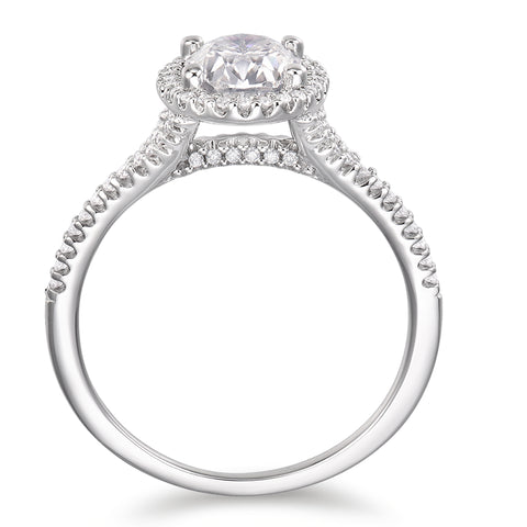oval cut moissanite ring with a halo and shoulder stones in 14K white gold